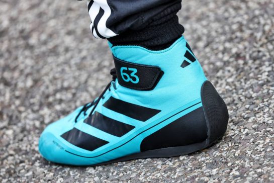 George Russell (GBR) Mercedes AMG F1 - racing boot - at a team photograph.
07.12.2025. Formula 1 World Championship, Rd 24, Abu Dhabi Grand Prix, Yas Marina Circuit, Abu Dhabi, Race Day.
- www.xpbimages.com, EMail: requests@xpbimages.com © Copyright: Charniaux / XPB Images