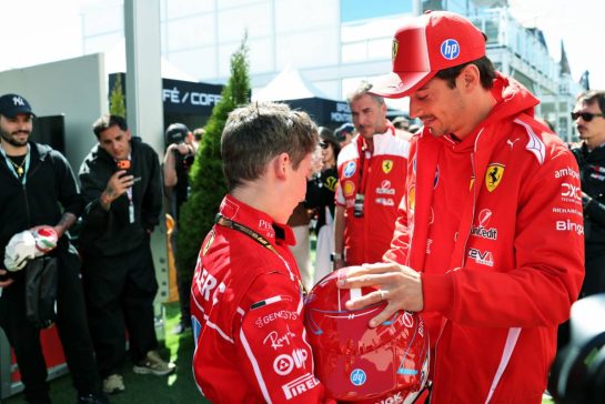 Charles Leclerc (MON) Scuderia Ferrari with a young fan.
22.05.2026. Formula 1 World Championship, Rd 5, Canadian Grand Prix, Montreal, Canada, Sprint Qualifying Day.
- www.xpbimages.com, EMail: requests@xpbimages.com © Copyright: Bearne / XPB Images