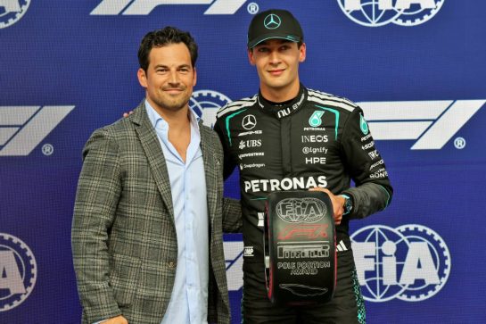 (L to R): Giacomo Gianniotti (CDN) (ITA) Actor presents the Pirelli Pole Position Award to George Russell (GBR) Mercedes AMG Formula One Team in qualifying parc ferme.
23.05.2026. Formula 1 World Championship, Rd 5, Canadian Grand Prix, Montreal, Canada, Sprint and Qualifying Day.
- www.xpbimages.com, EMail: requests@xpbimages.com © Copyright: Batchelor / XPB Images