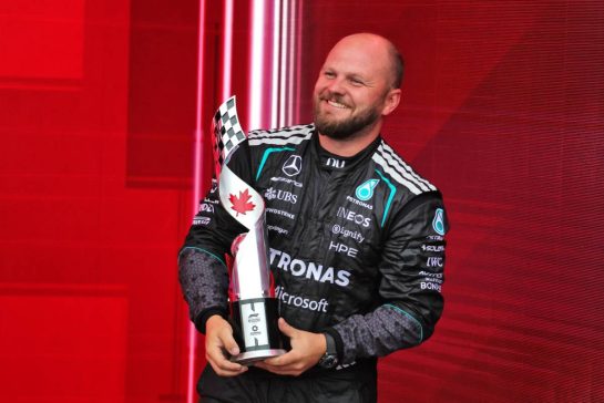 Dean Hale (GBR) Mercedes AMG F1 Formula One Team Senior Travelling Composite Technician celebrates on the podium.
24.05.2026. Formula 1 World Championship, Rd 5, Canadian Grand Prix, Montreal, Canada, Race Day.
- www.xpbimages.com, EMail: requests@xpbimages.com © Copyright: Moy / XPB Images