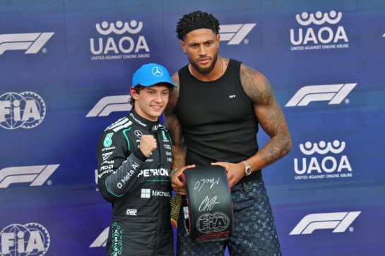 (L to R): Andrea Kimi Antonelli (ITA) Mercedes AMG Formula One Team receives the Pirelli Pole Position Award in qualifying parc ferme from Maduka Okoye (GER) Football Goalkeeper.
04.07.2026. Formula 1 World Championship, Rd 9, British Grand Prix, Silverstone, England, Sprint and Qualifying Day.
- www.xpbimages.com, EMail: requests@xpbimages.com © Copyright: Batchelor / XPB Images