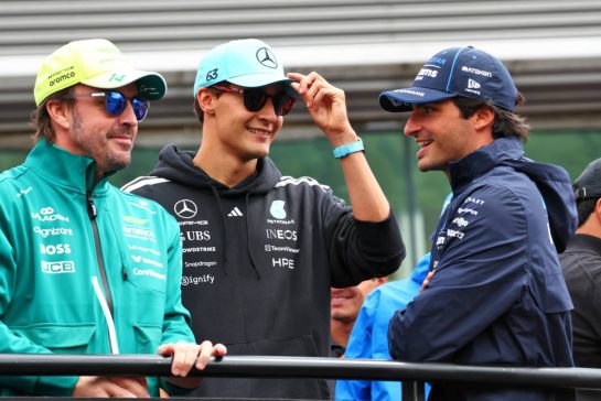 (L to R): Fernando Alonso (ESP) Aston Martin F1 Team with George Russell (GBR) Mercedes AMG Formula One Team and Carlos Sainz (ESP) Williams F1 Team on the drivers' parade.
19.07.2026. Formula 1 World Championship, Rd 10, Belgian Grand Prix, Spa Francorchamps, Belgium, Race Day.
- www.xpbimages.com, EMail: requests@xpbimages.com © Copyright: Bearne / XPB Images