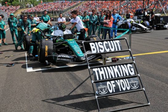 A pit board sending best wishes to Mick 'Biscuit' Fern (GBR) Aston Martin F1 Team Tyre Technician with Fernando Alonso (ESP) Aston Martin F1 Team AMR26 on the grid.
26.07.2026. Formula 1 World Championship, Rd 11, Hungarian Grand Prix, Budapest, Hungary, Race Day.
- www.xpbimages.com, EMail: requests@xpbimages.com © Copyright: Batchelor / XPB Images