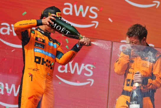 (L to R): Race winner Lando Norris (GBR) McLaren F1 Team celebrates on the podium with Kyle Moreira (GBR) McLaren F1 Team No. 1 Mechanic.
26.07.2026. Formula 1 World Championship, Rd 11, Hungarian Grand Prix, Budapest, Hungary, Race Day.
- www.xpbimages.com, EMail: requests@xpbimages.com © Copyright: Moy / XPB Images