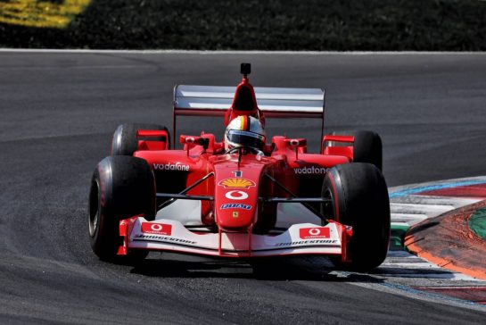 Sebastian Vettel (GER) drives the 2002 Ferrari F2002.
06.09.2026. Formula 1 World Championship, Rd 13, Italian Grand Prix, Monza, Italy, Race Day.
- www.xpbimages.com, EMail: requests@xpbimages.com © Copyright:  Rew / XPB Images