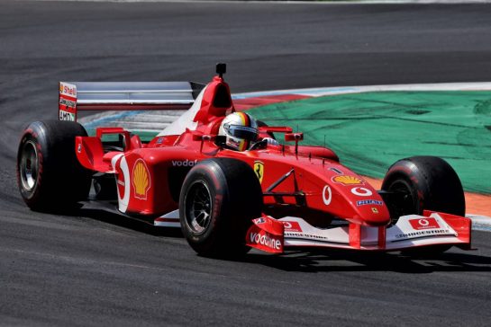 Sebastian Vettel (GER) drives the 2002 Ferrari F2002.
06.09.2026. Formula 1 World Championship, Rd 13, Italian Grand Prix, Monza, Italy, Race Day.
- www.xpbimages.com, EMail: requests@xpbimages.com © Copyright:  Rew / XPB Images