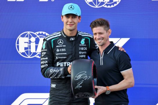(L to R): George Russell (GBR) Mercedes AMG Formula One Team receives the Pirelli Pole Position Award from Casey Stoner (AUS) former MotoGP Rider in qualifying parc ferme.
25.09.2026. Formula One World Championship, Rd 15, Azerbaijan Grand Prix, Baku, Azerbaijan, Qualifying Day.
- www.xpbimages.com, EMail: requests@xpbimages.com © Copyright: Batchelor / XPB Images