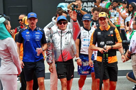 (L to R): Max Verstappen (NLD) Red Bull Racing with Andrea Kimi Antonelli (ITA) Mercedes AMG Formula One Team and Oscar Piastri (AUS) McLaren F1 Team on the drivers' parade.
04.10.2026. Formula 1 World Championship, Rd 16, Bahrain Grand Prix, Sepang, Malaysia, Race Day.
- www.xpbimages.com, EMail: requests@xpbimages.com © Copyright: Bearne / XPB Images