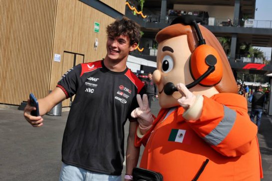 (L to R): Oliver Bearman (GBR) Haas F1 Team with a marshal mascot.
29.10.2026. Formula 1 World Championship, Rd 19, Mexico City Grand Prix, Mexico City, Mexico, Preparations Day.
- www.xpbimages.com, EMail: requests@xpbimages.com © Copyright: Moy / XPB Images